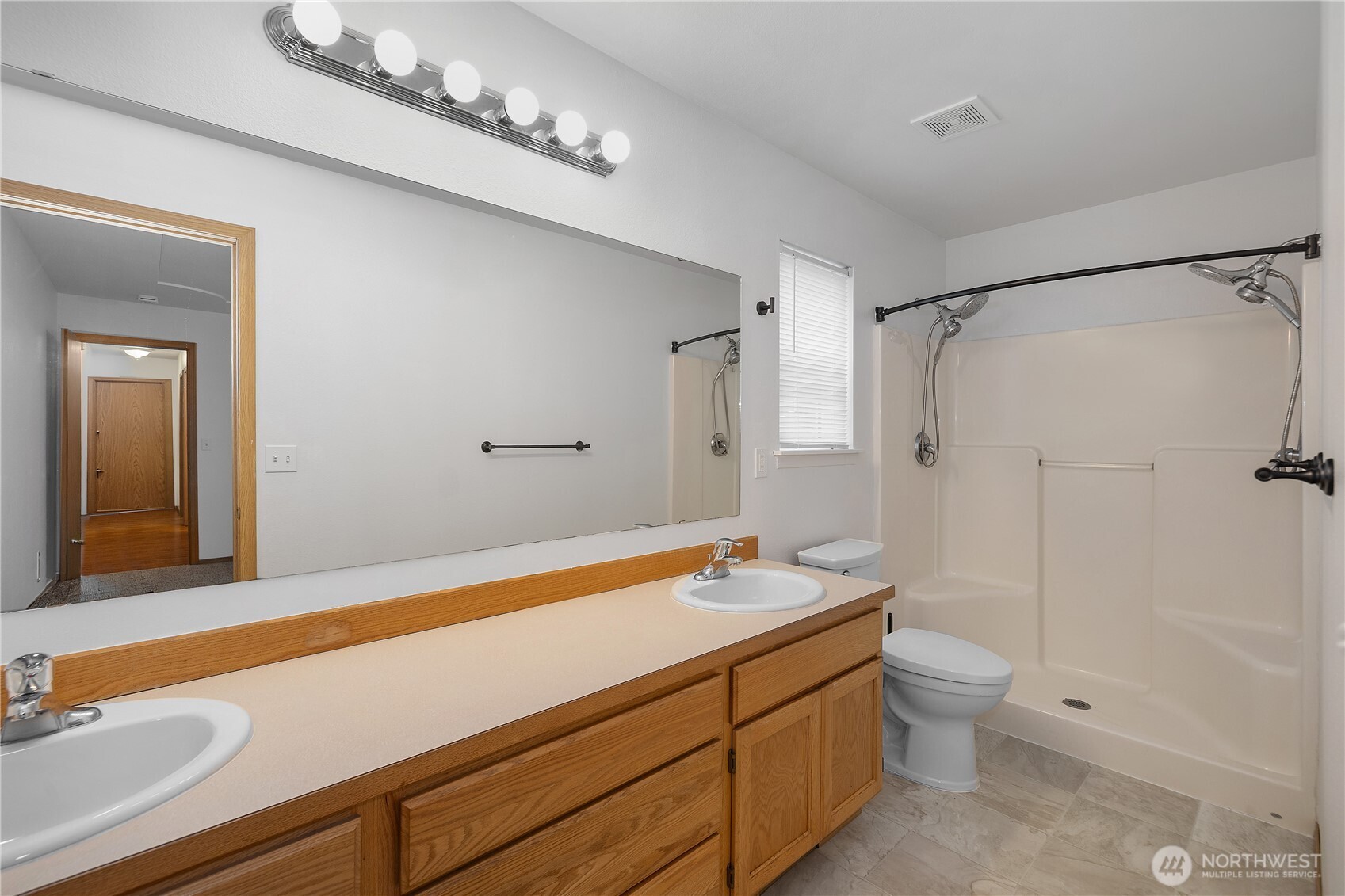 7606 187th Avenue Southwest Rochester, WA 98579 - Photo 17 of 28 a bathroom with a sink a toilet and shower