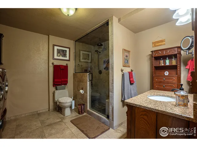 a bedroom with a bed and flat screen tv