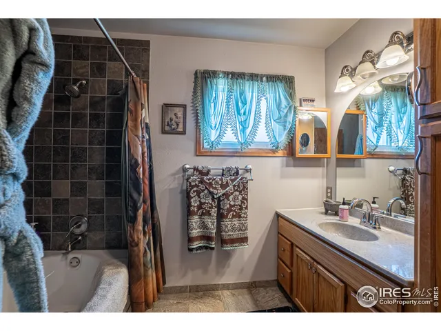 a bathroom with a toilet a sink and tub