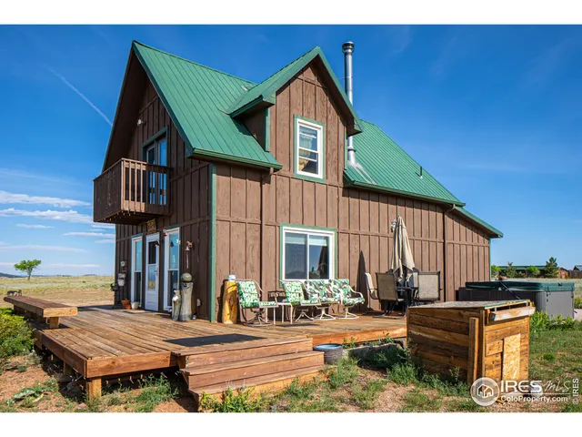 a view of backyard with cabin