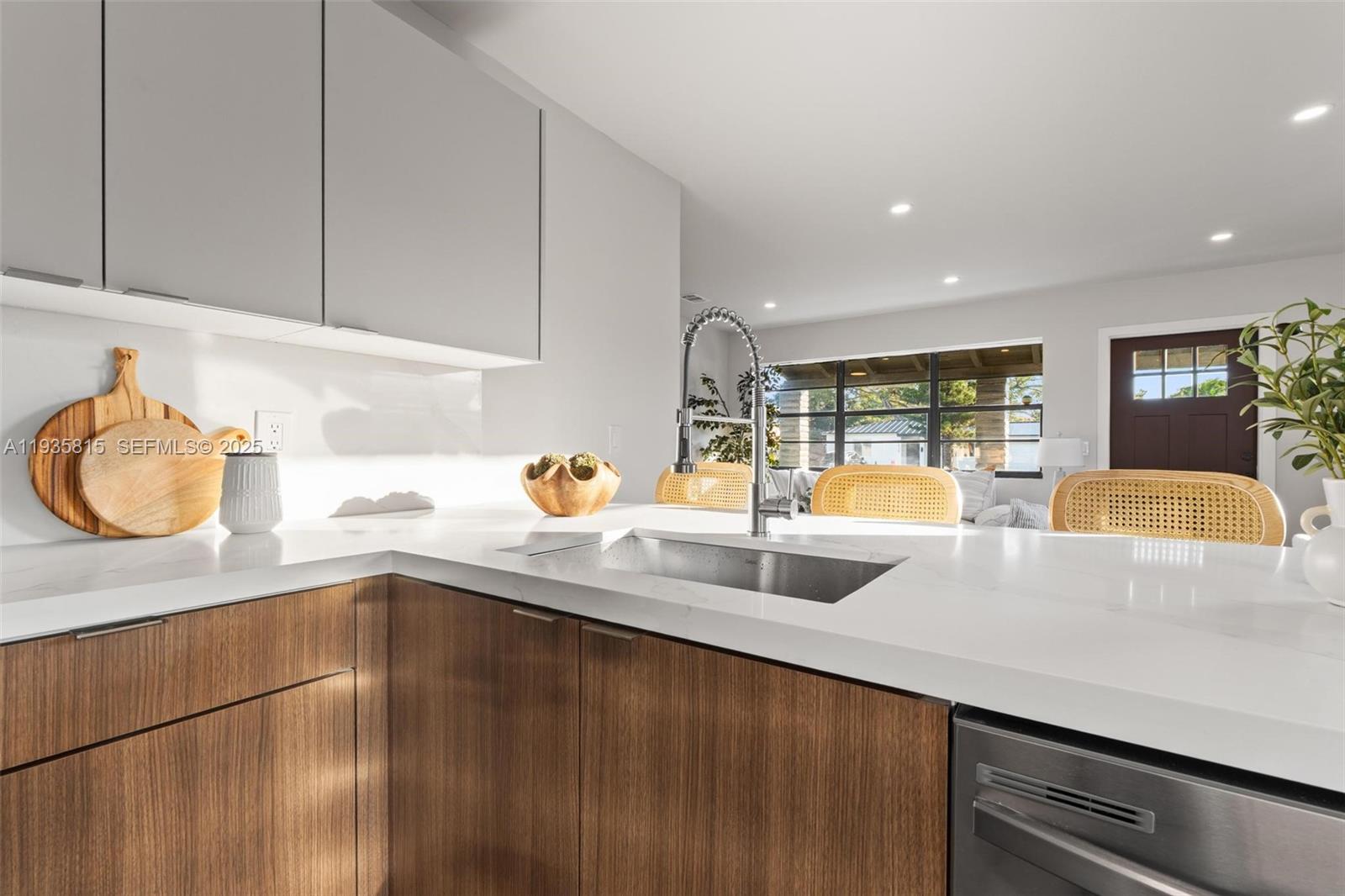 2439 Rodman Street Hollywood, FL 33020 - Photo 14 of 28 a kitchen with a sink and a window