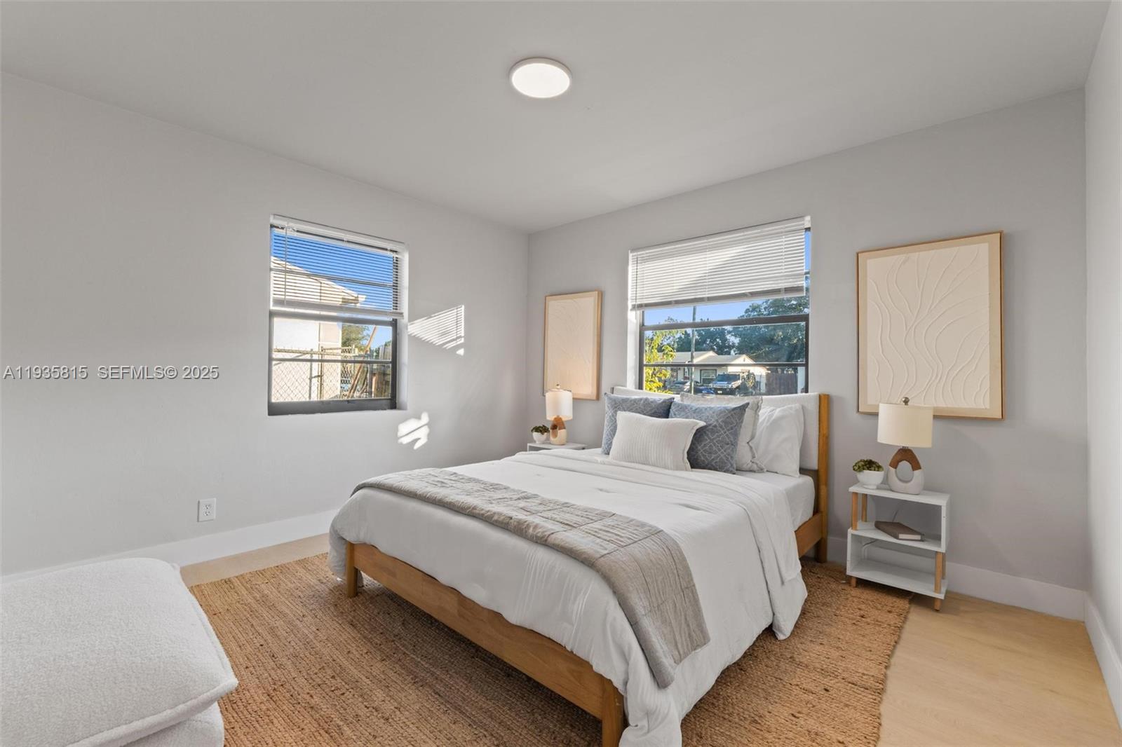 2439 Rodman Street Hollywood, FL 33020 - Photo 18 of 28 a bedroom with a bed and a window