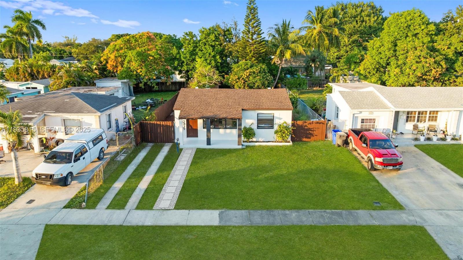 2439 Rodman Street Hollywood, FL 33020 - Photo 2 of 28 a view of an house with backyard space and sitting area