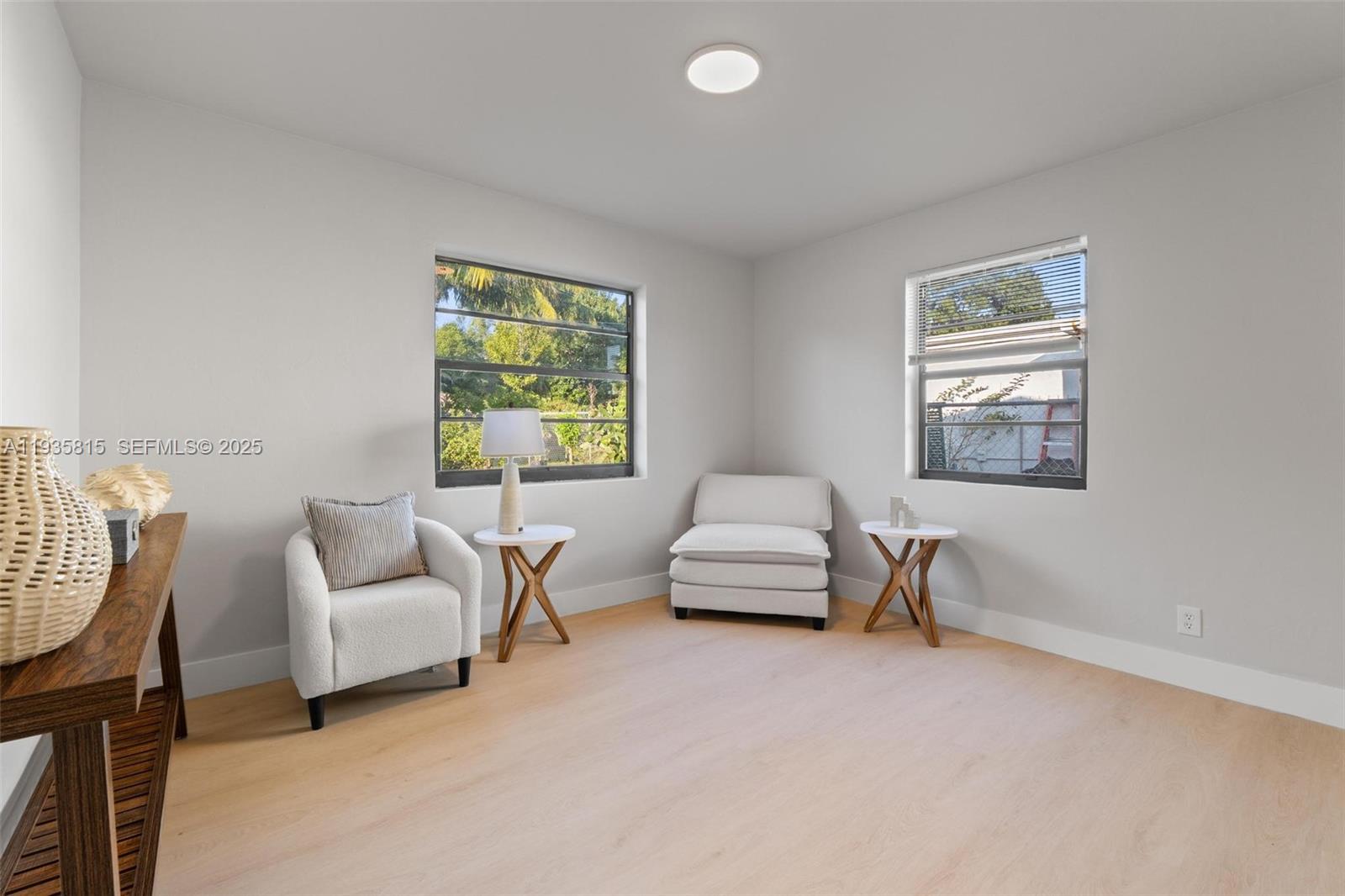 2439 Rodman Street Hollywood, FL 33020 - Photo 21 of 28 a living room with furniture and a window