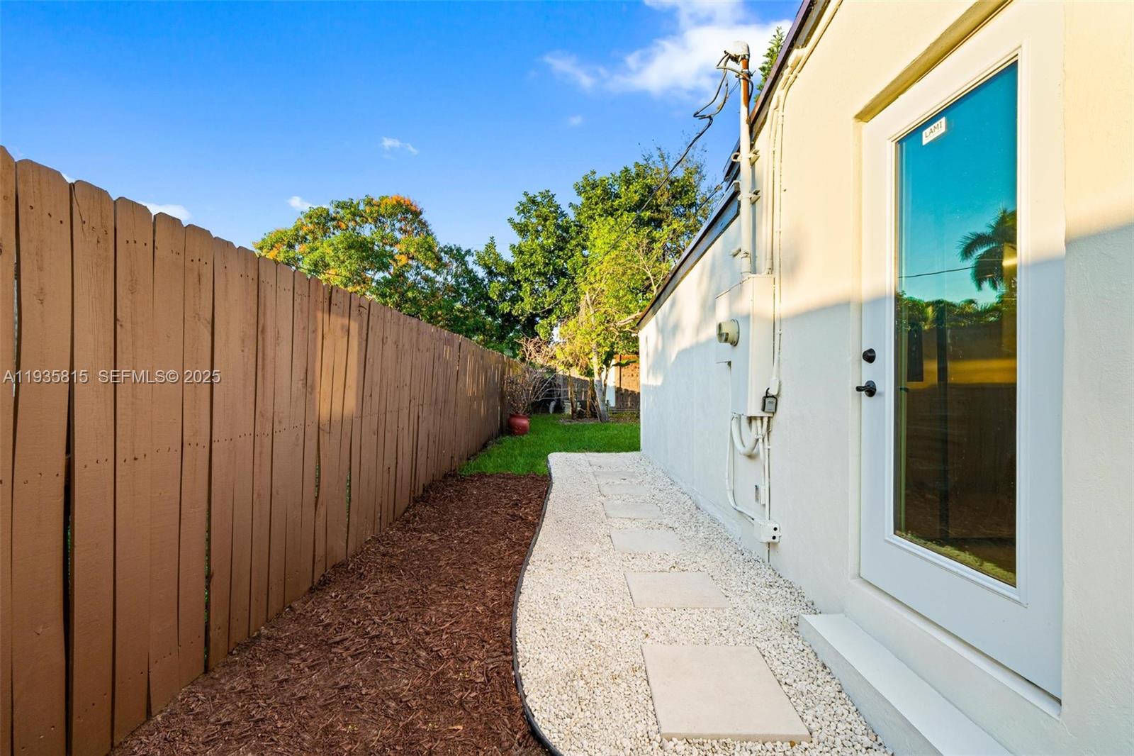 2439 Rodman Street Hollywood, FL 33020 - Photo 23 of 28 a view of a house with a backyard