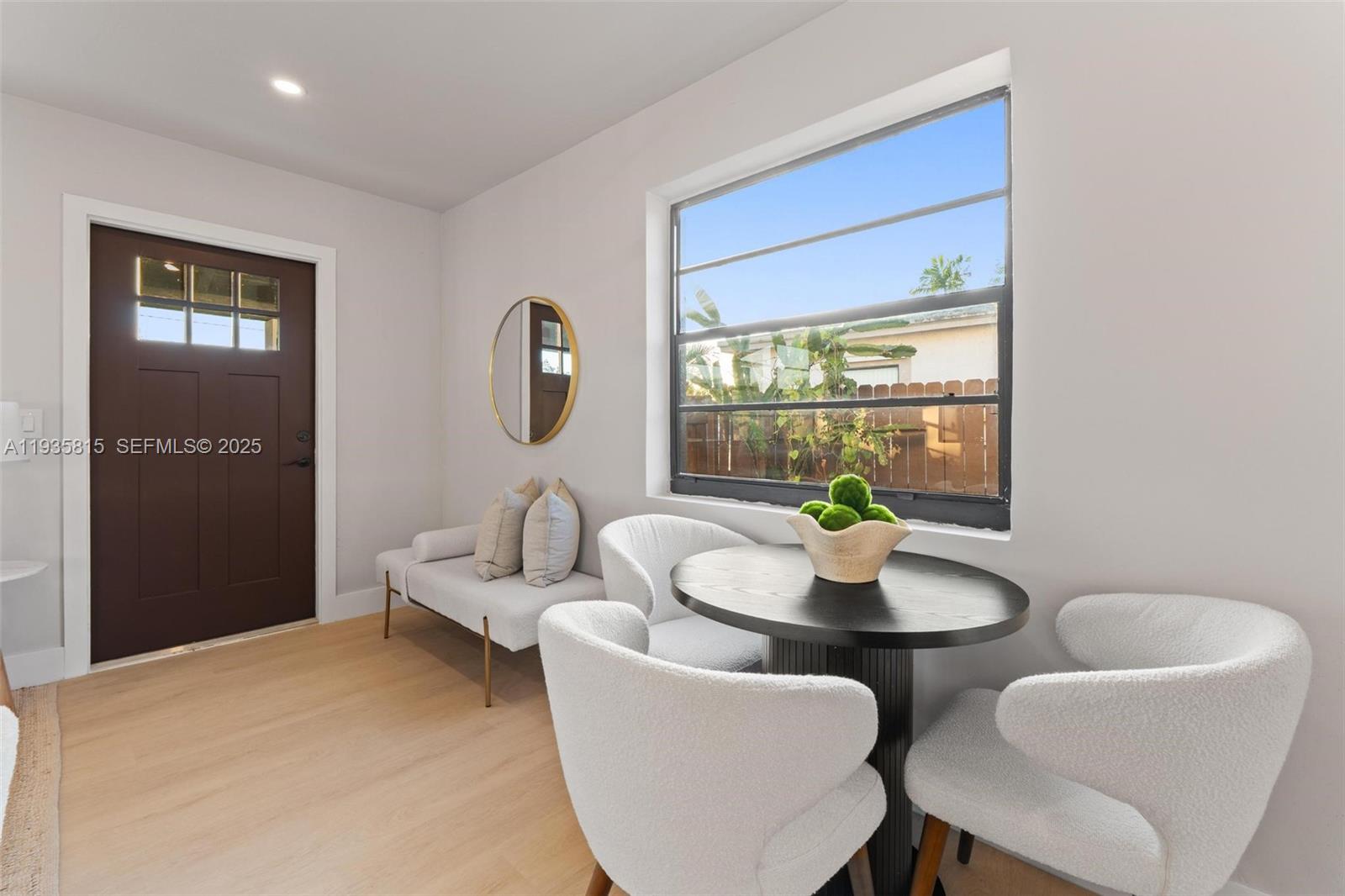 2439 Rodman Street Hollywood, FL 33020 - Photo 5 of 28 a living room with furniture and a window
