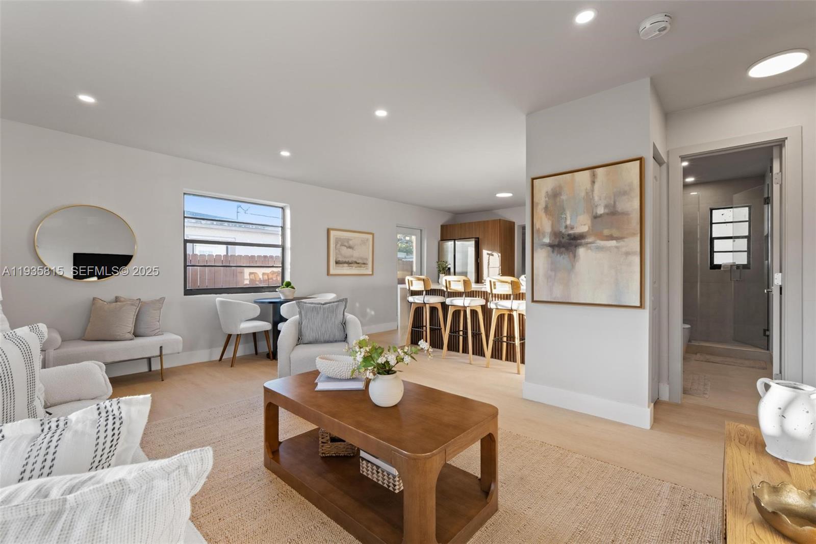 2439 Rodman Street Hollywood, FL 33020 - Photo 7 of 28 a living room with furniture and wooden floor