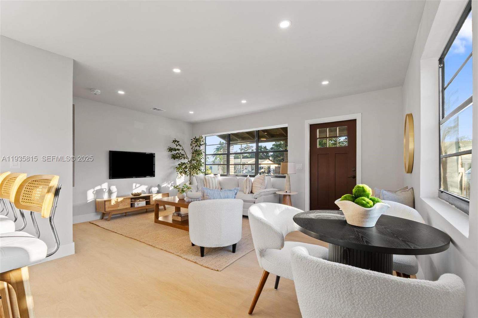 2439 Rodman Street Hollywood, FL 33020 - Photo 9 of 28 a living room with fireplace furniture and a flat screen tv