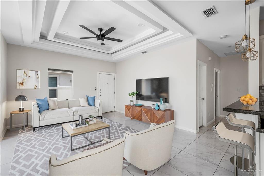 5805 Puffin Avenue, Unit 1 Mission, TX 78573 - Photo 7 of 7 a living room with furniture a ceiling fan and a rug
