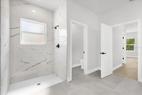 a bathroom with a bathtub and shower