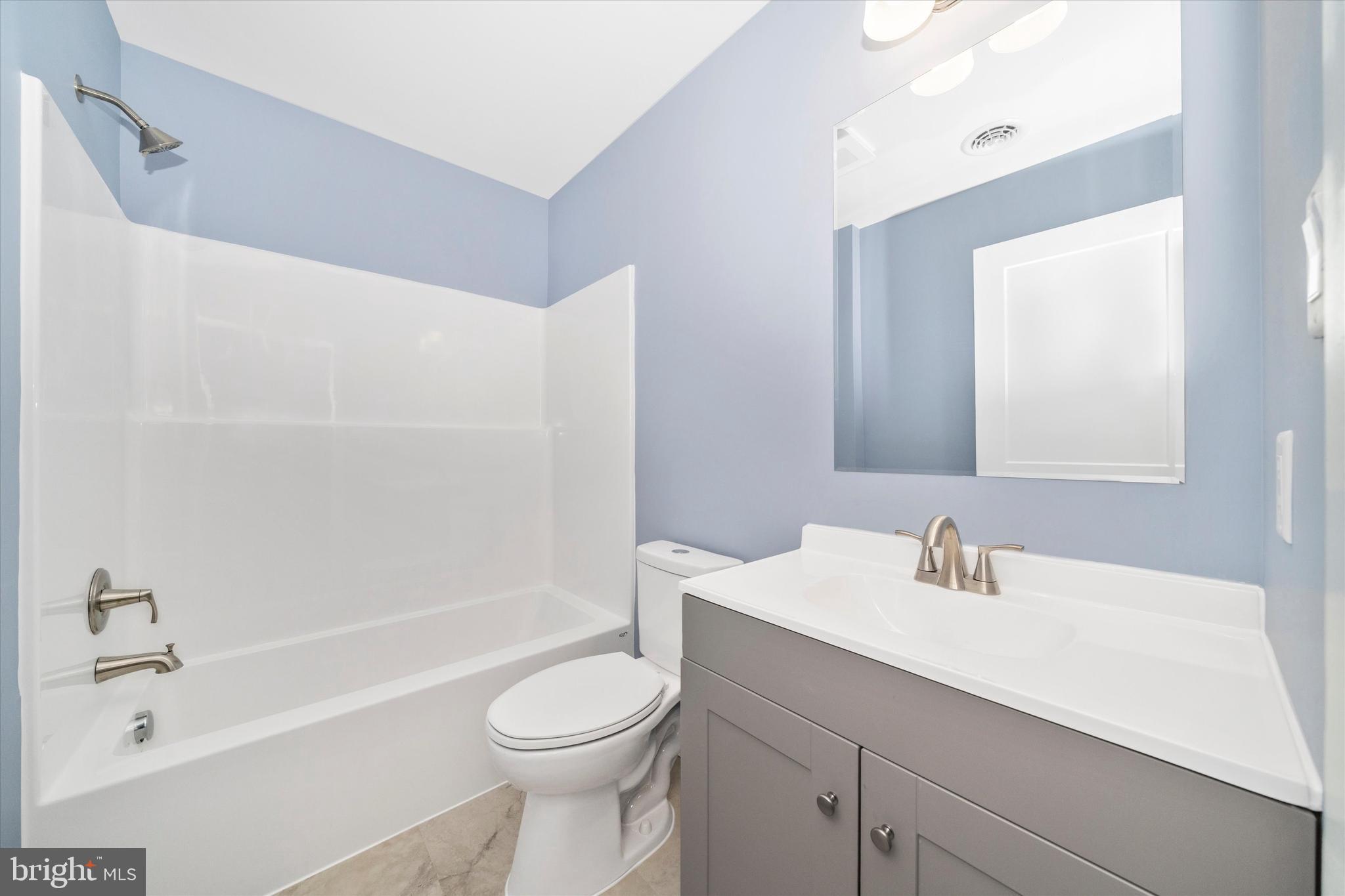 17410 Gay Street Hagerstown, MD 21740 - Photo 22 of 34 a bathroom with a sink a toilet and shower