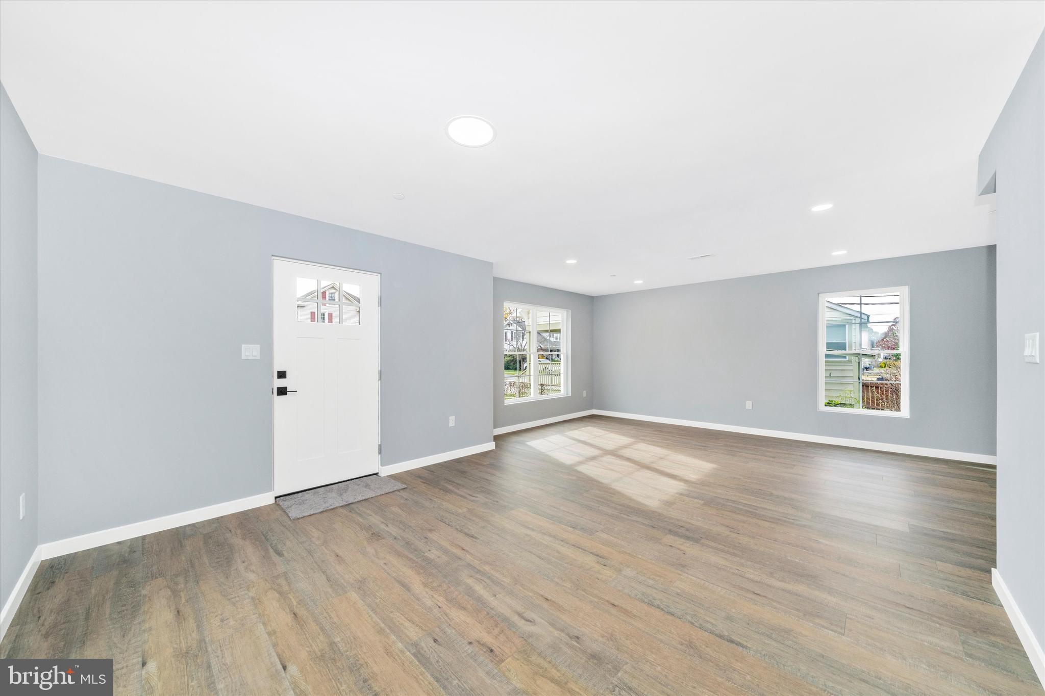 17410 Gay Street Hagerstown, MD 21740 - Photo 3 of 34 an empty room with wooden floor and windows
