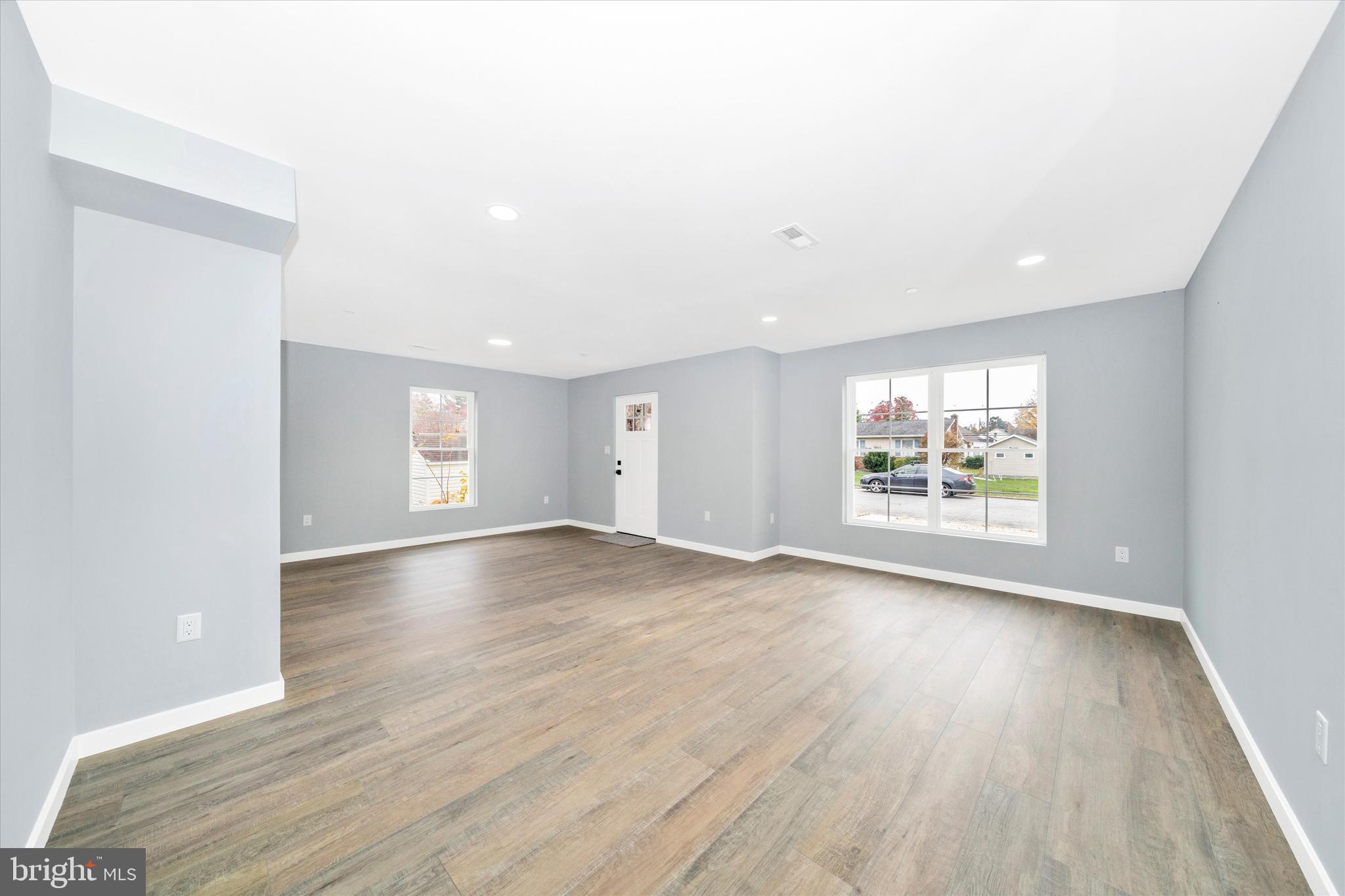 17410 Gay Street Hagerstown, MD 21740 - Photo 6 of 34 an empty room with wooden floor and windows