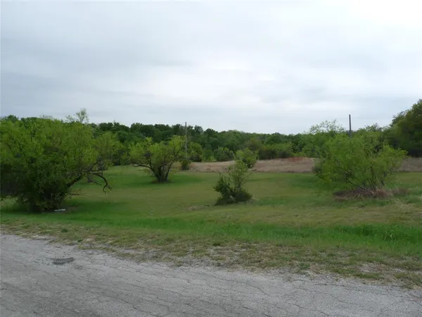 a view of a field with sitting area