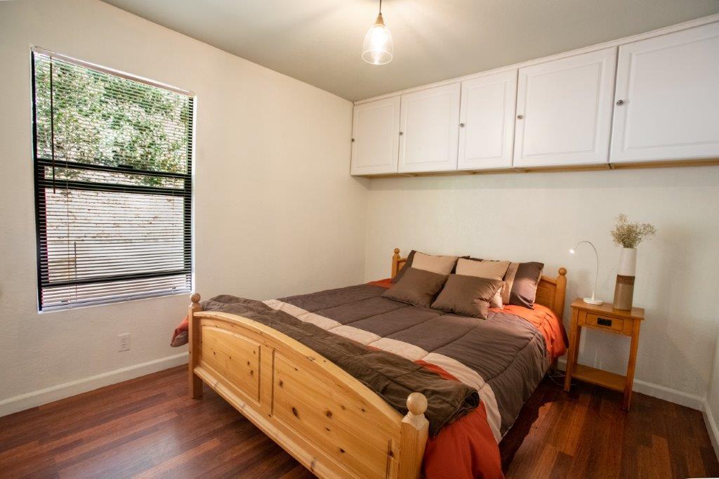 130 Strawberry Road Watsonville, CA 95076 - Photo 12 of 27 a bed sitting in a bedroom next to a window