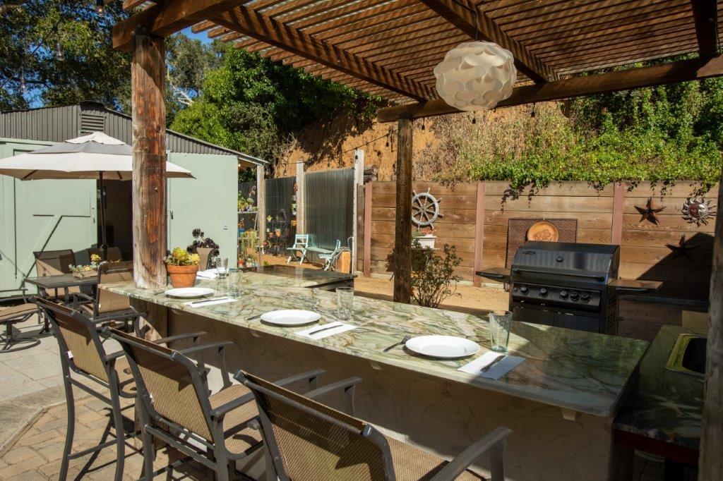130 Strawberry Road Watsonville, CA 95076 - Photo 16 of 27 a view of a dining table and chairs in the patio