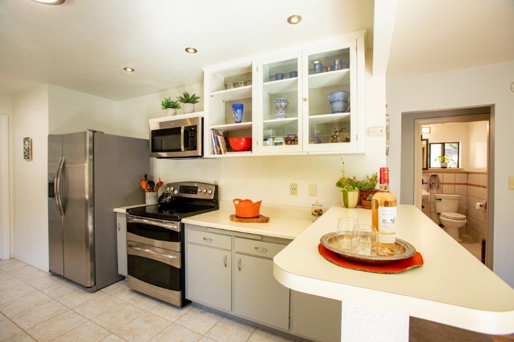 130 Strawberry Road Watsonville, CA 95076 - Photo 6 of 27 a kitchen with stainless steel appliances a stove a sink and a refrigerator