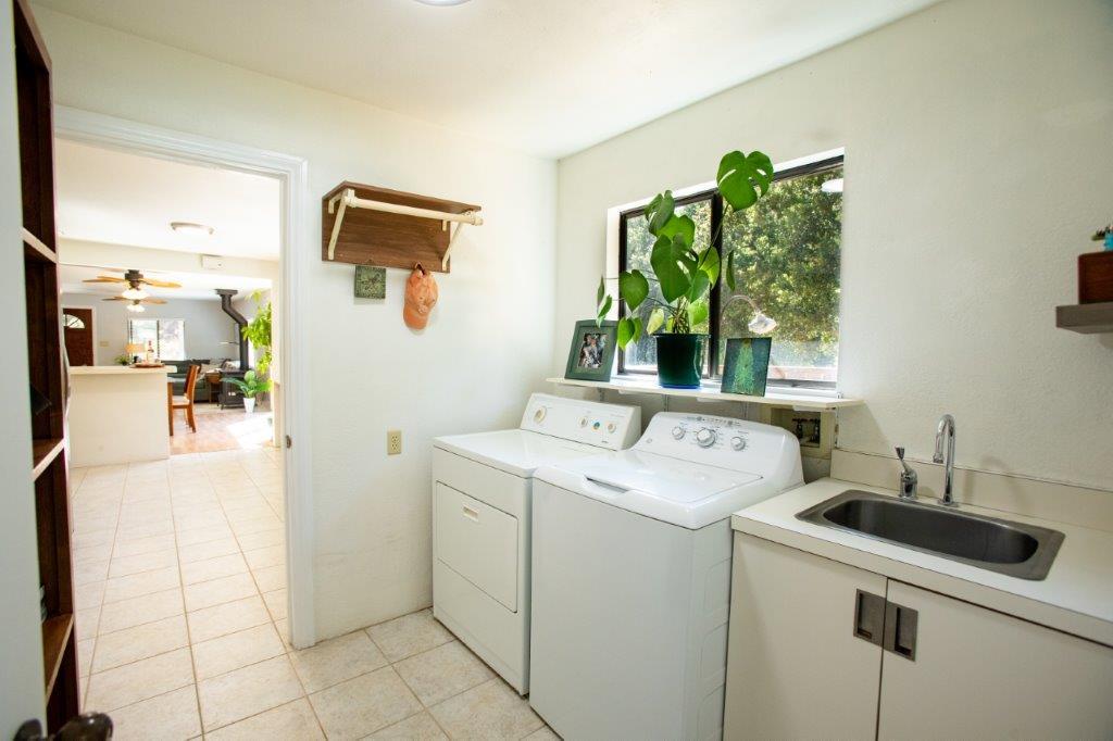 130 Strawberry Road Watsonville, CA 95076 - Photo 8 of 27 a utility room with dryer and washer