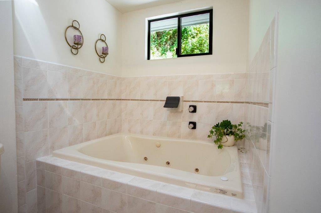130 Strawberry Road Watsonville, CA 95076 - Photo 10 of 27 a white bath tub with a window