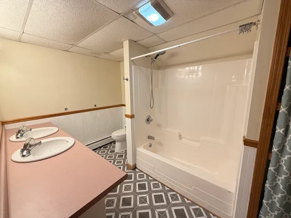 a bedroom with furniture and a wooden floor