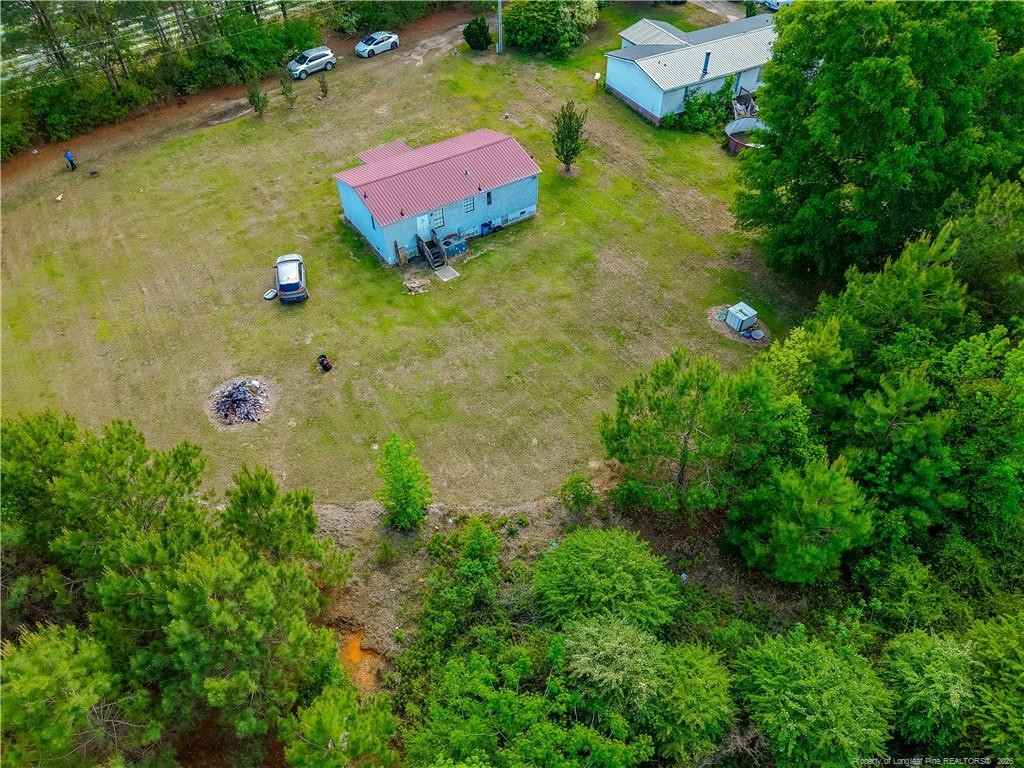 231 Knight Lane Autryville, NC 28318 - Photo 13 of 27 an aerial view of residential houses with outdoor space and trees all around