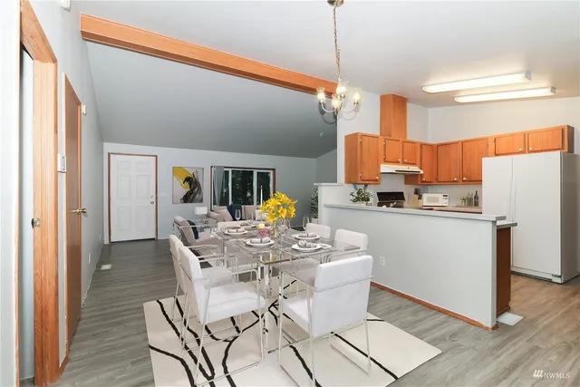a view of a dining room with furniture window and wooden floor