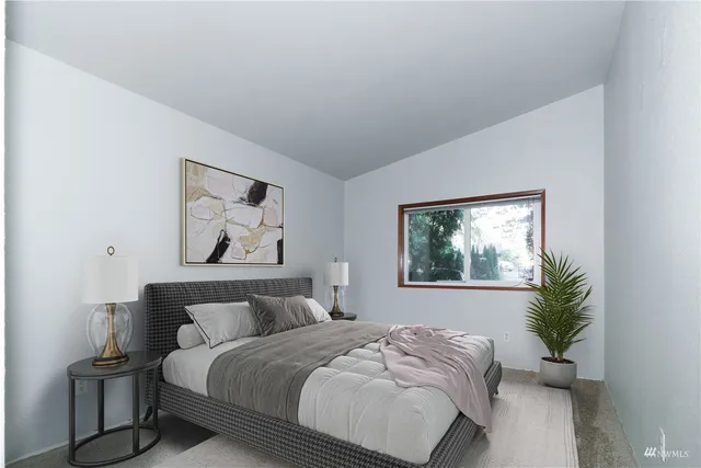 a bedroom with bed and a window