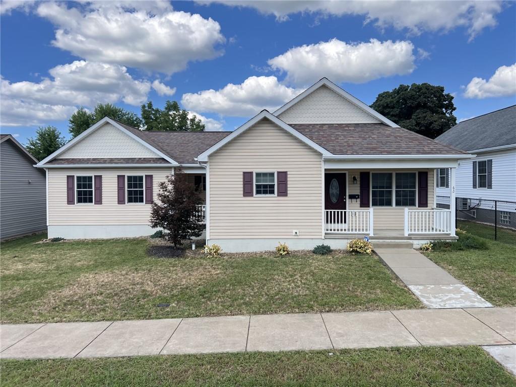 43 Maple Street Uniontown, PA 15401 - Photo 1 of 26 a view of a yard in front of a house with large windows