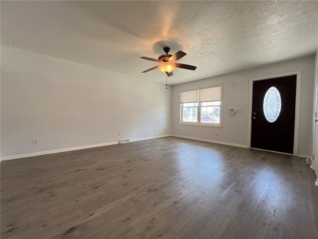 43 Maple Street Uniontown, PA 15401 - Photo 6 of 26 an empty room with wooden floor and windows
