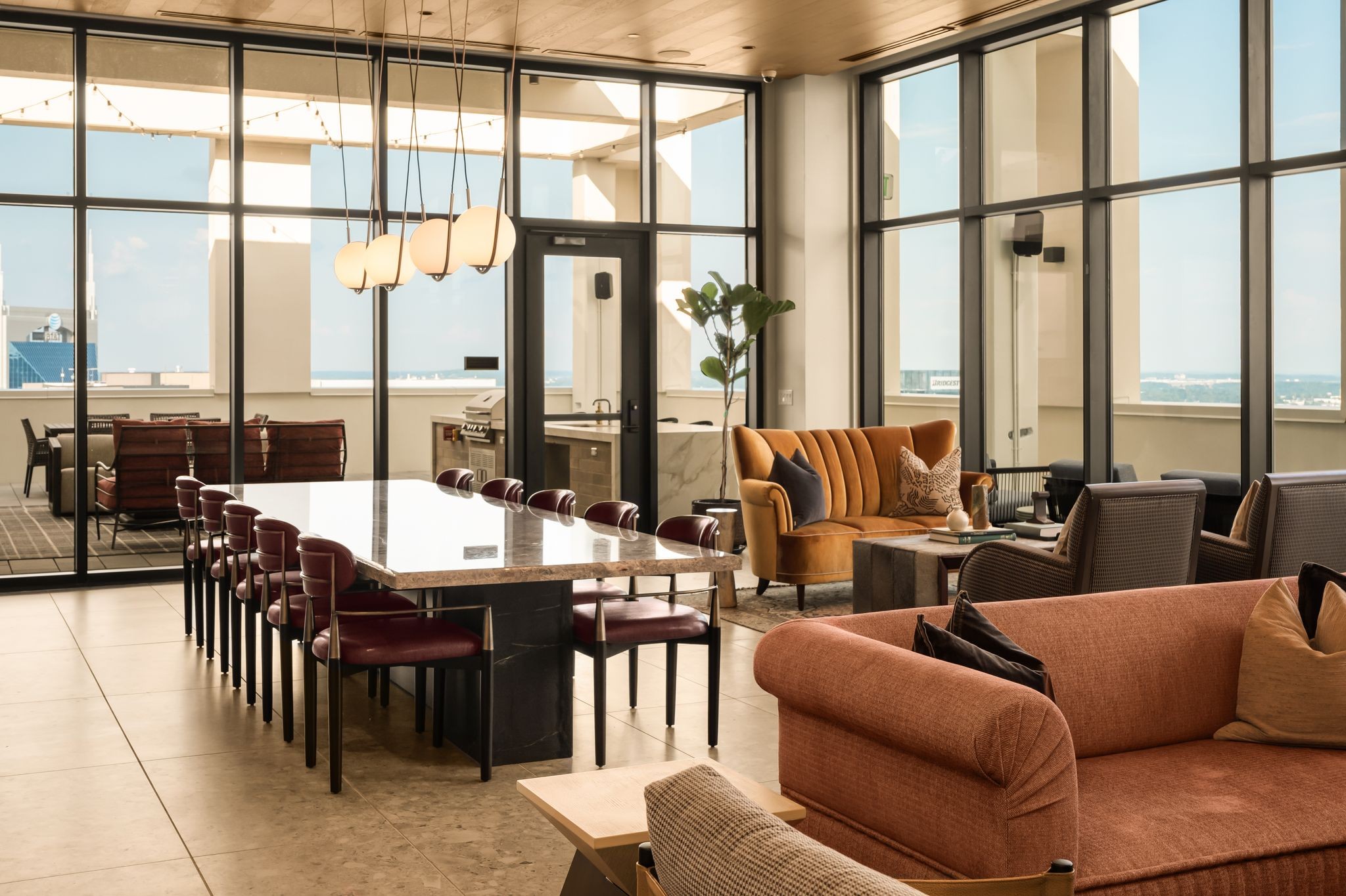 930 Commerce Street, Unit 10 Nashville, TN 37203 - Photo 27 of 34 a living room with furniture and floor to ceiling windows