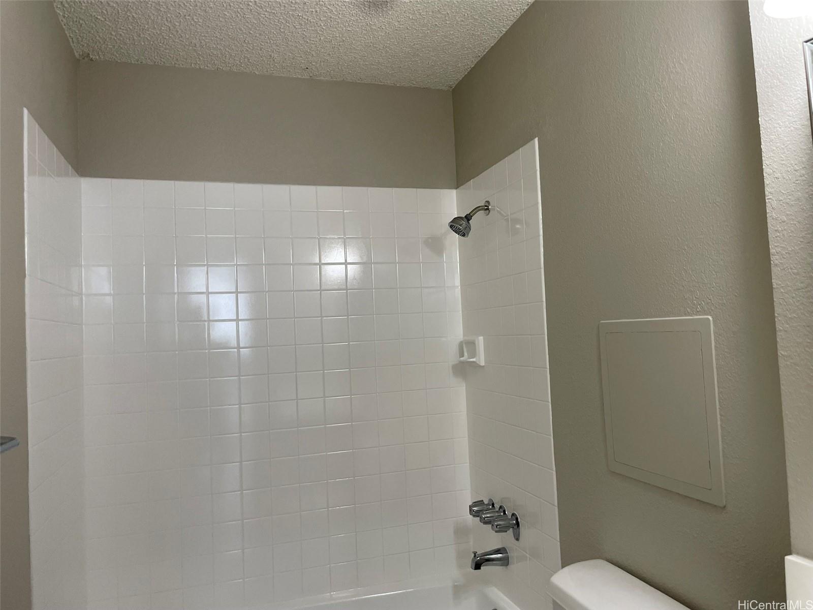 620 Sheridan Street, Unit 404 Honolulu, HI 96814 - Photo 7 of 10 a bathroom with a shower and a toilet