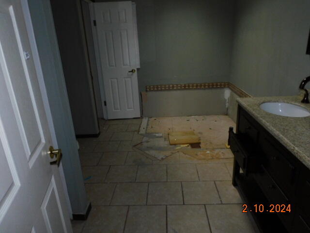 2193 Nemmo Road Vinton, VA 24179 - Photo 11 of 12 a bathroom with a granite countertop sink and a toilet