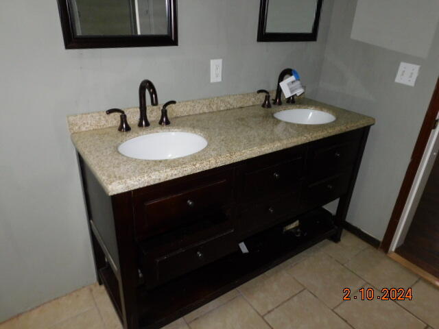 2193 Nemmo Road Vinton, VA 24179 - Photo 12 of 12 a sink vanity granite and a mirror
