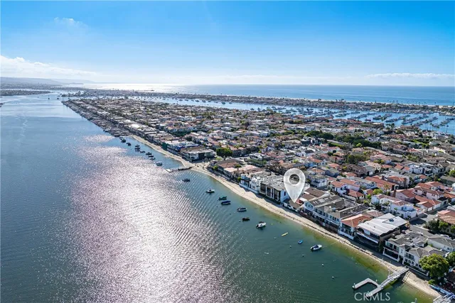 an aerial view of a house with a lake view