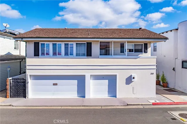 a view of a swimming pool with an outdoor seating and a palm tree