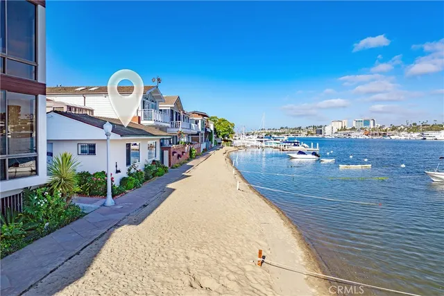 a view of a city with lots of residential buildings and ocean view