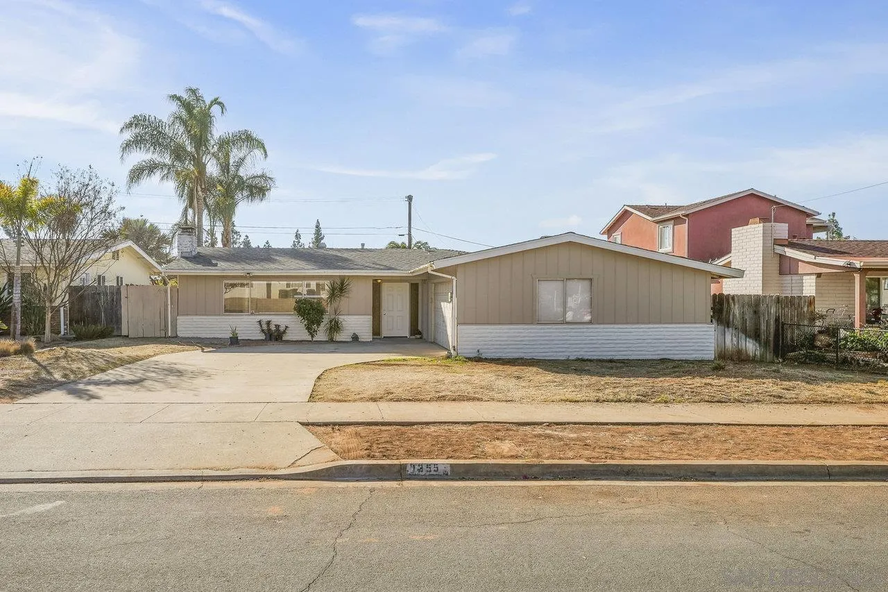 a house with palm tree in front of it