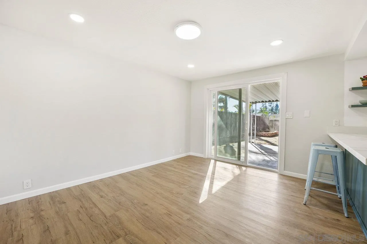 1355 Bluebell Way El Cajon, CA 92021 - Photo 11 of 33 wooden floor in an empty room with a window