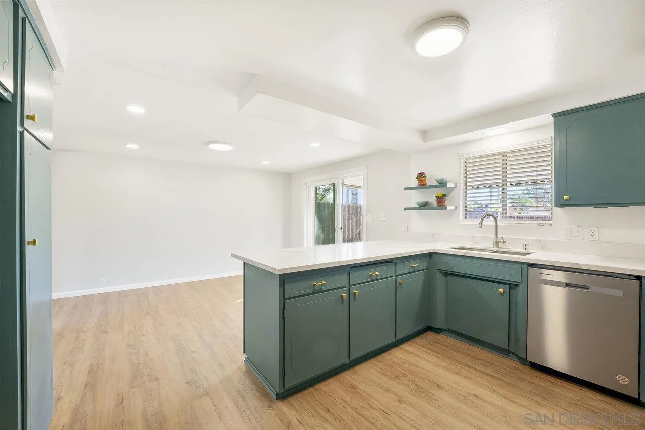 1355 Bluebell Way El Cajon, CA 92021 - Photo 14 of 33 a kitchen with sink and cabinets