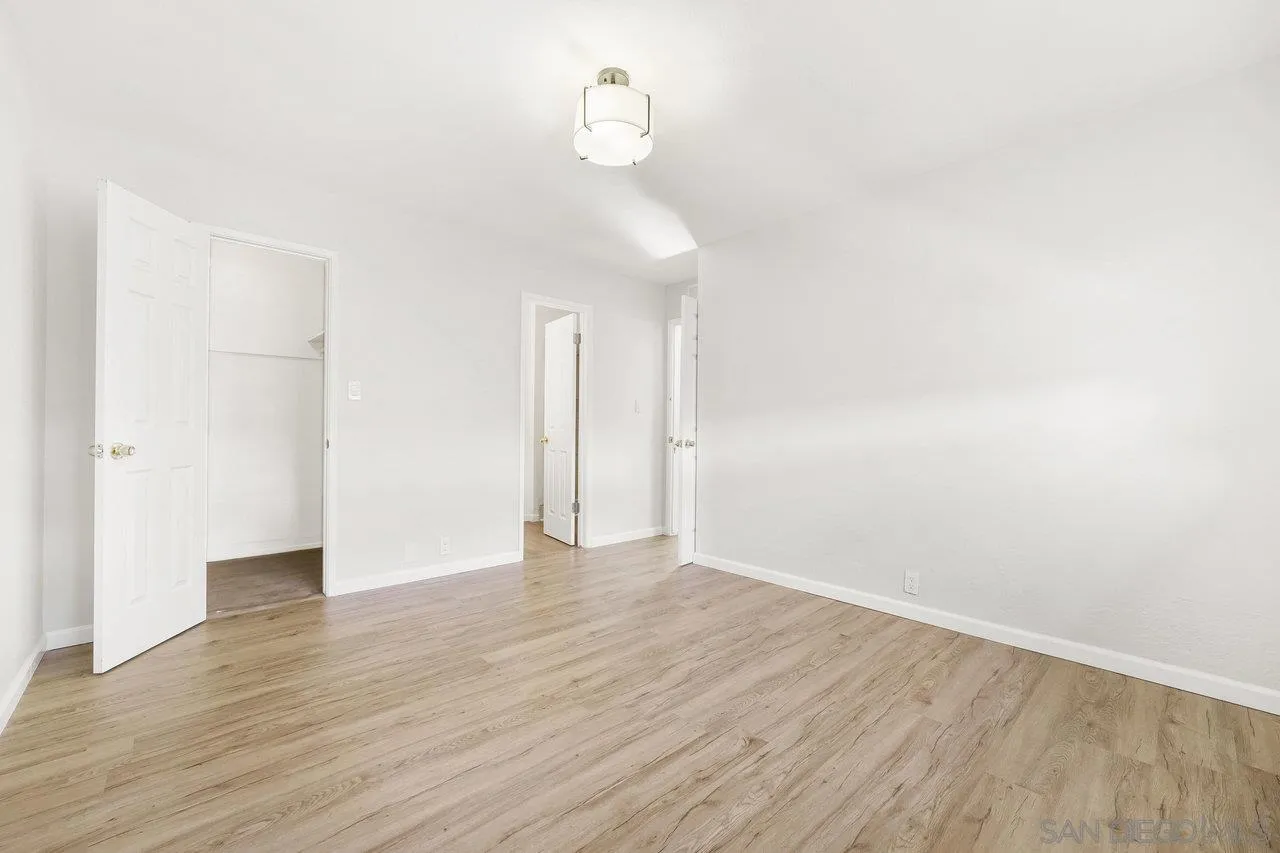 1355 Bluebell Way El Cajon, CA 92021 - Photo 24 of 33 a view of an empty room with wooden floor