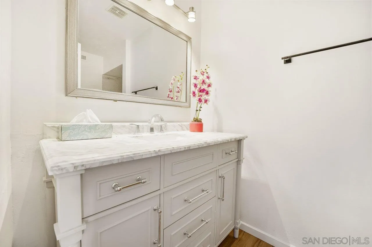 1355 Bluebell Way El Cajon, CA 92021 - Photo 26 of 33 a bathroom with a sink and a mirror