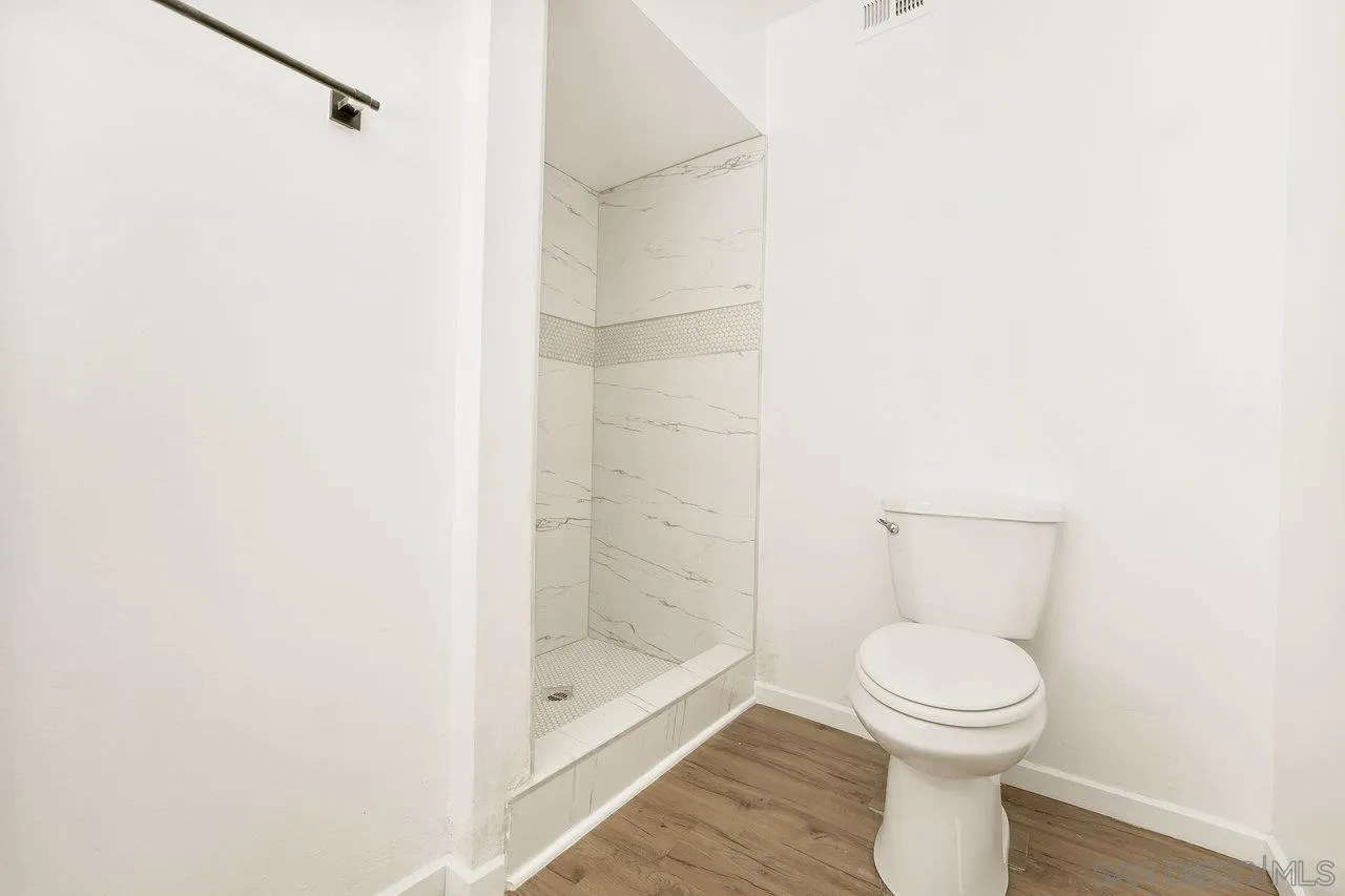 1355 Bluebell Way El Cajon, CA 92021 - Photo 27 of 33 a bathroom with a toilet and a shower