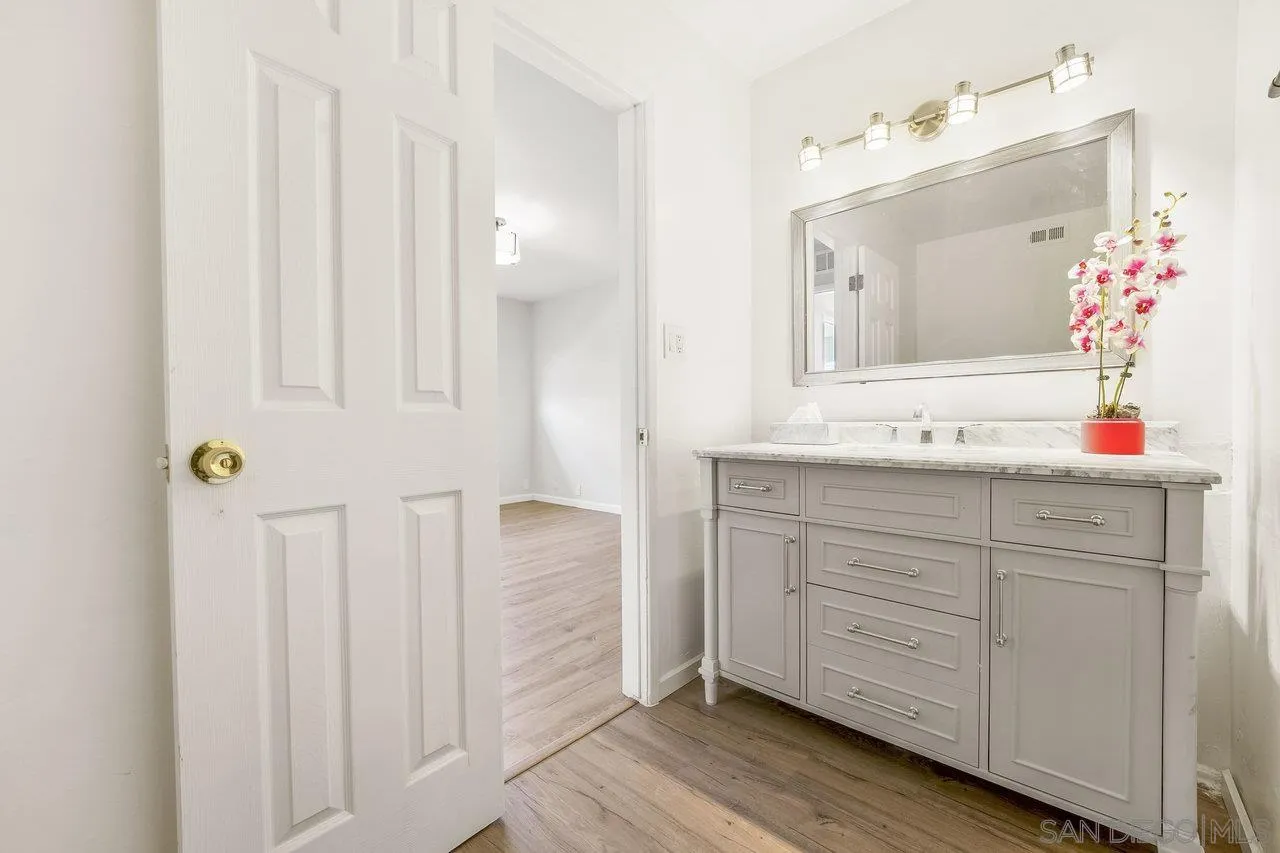 1355 Bluebell Way El Cajon, CA 92021 - Photo 28 of 33 a bathroom with a sink and a mirror