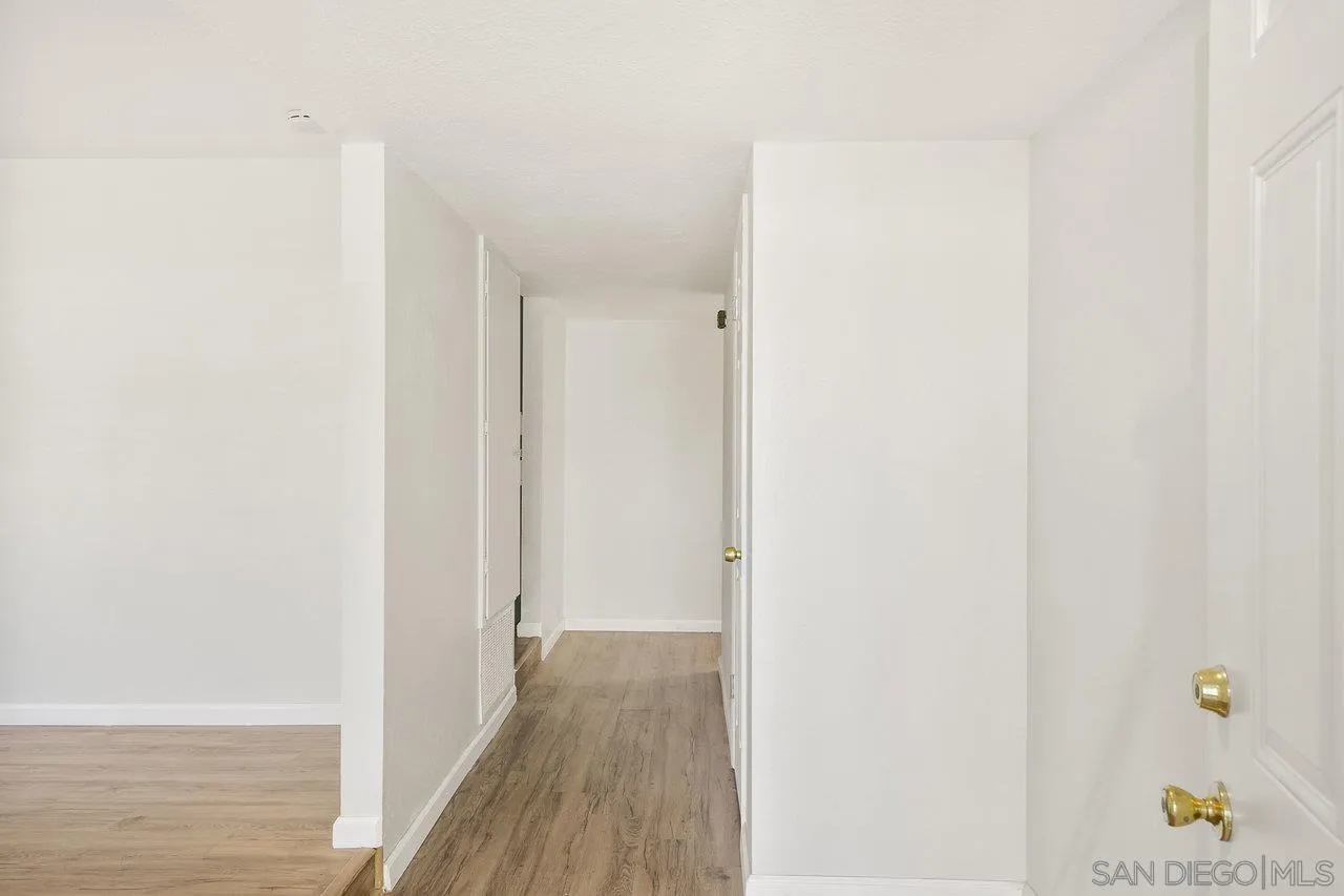 1355 Bluebell Way El Cajon, CA 92021 - Photo 4 of 33 a view of a hallway with wooden floor
