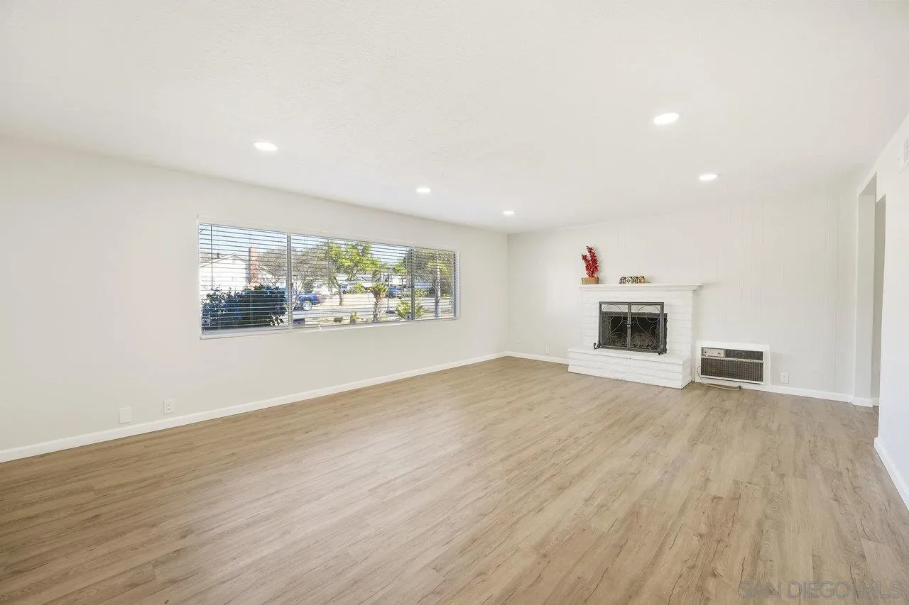1355 Bluebell Way El Cajon, CA 92021 - Photo 6 of 33 a view of livingroom with hardwood floor and kitchen view