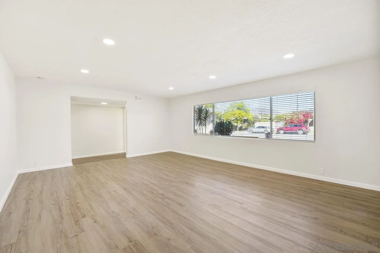 1355 Bluebell Way El Cajon, CA 92021 - Photo 7 of 33 an empty room with wooden floor and window