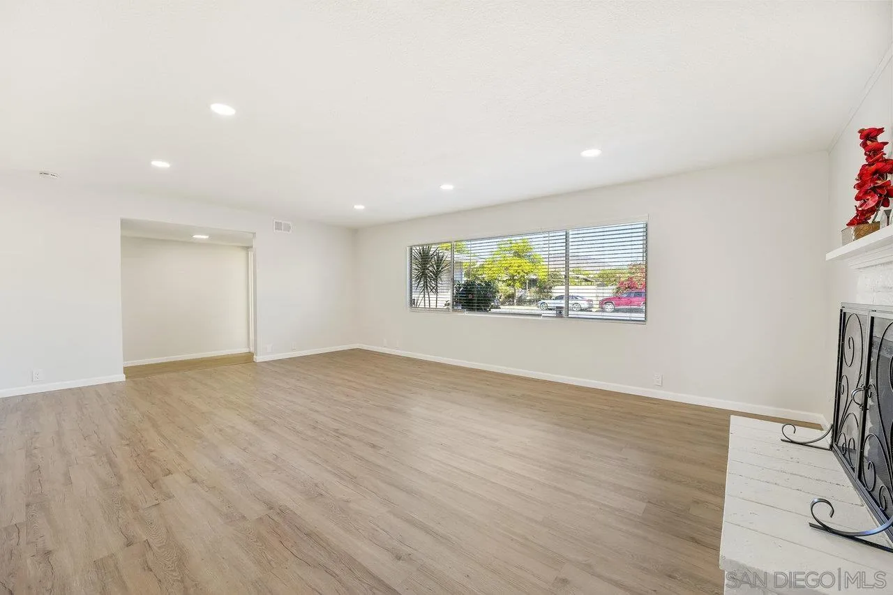 1355 Bluebell Way El Cajon, CA 92021 - Photo 8 of 33 an empty room with wooden floor and window