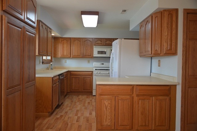 7 East Oltendorf Road Streamwood, IL 60107 - Photo 2 of 17 a kitchen with a refrigerator sink and cabinets