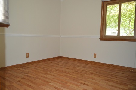 7 East Oltendorf Road Streamwood, IL 60107 - Photo 11 of 17 an empty room with wooden floor and windows