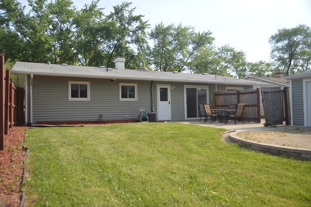 7 East Oltendorf Road Streamwood, IL 60107 - Photo 16 of 17 a backyard of a house with yard barbeque oven and outdoor seating